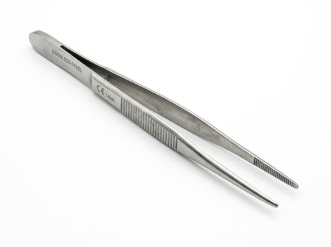 Close-up of metal surgical tweezers.