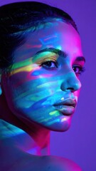 Fototapeta premium Serene Young Woman Posing with Colorful Neon Light Patterns in Studio Portrait