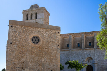 Fototapeta premium «Ibiza, Spain»; May 26 2026: The historic 13th-century Cathedral of Santa Maria, also known as Ibiza Cathedral, located at the highest point inside the fortified walls of Dalt Vila old town