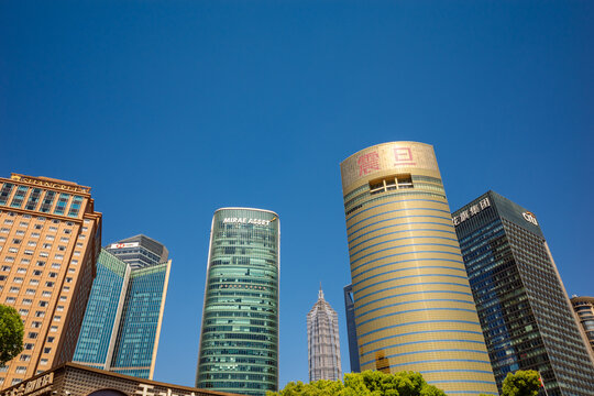 Low-Angle View of Lujiazui Financial District Skyscrapers with Aurora Plaza and Jin Mao Tower in Shanghai, China.