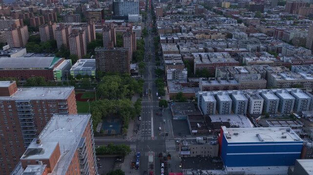 Urban landscape revealing the South Bronx borough with residential buildings, streets with traffic during an overcast afternoon in New York City