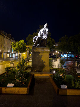 The composer Robert Schumann illuminated at night in Zwickau, Saxony, Germany