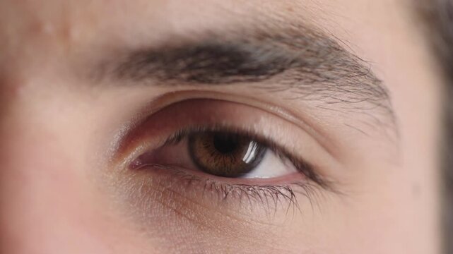 Face, man and eye with closeup for optometry, perception and awareness for eyesight. Portrait, male person and retina focus with peripheral vision, iris examination and optical care for visual health