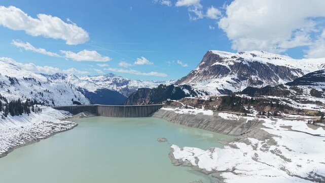 Aerial Pullback Above Kops Reservoir Dam in Tyrol in Wintertime