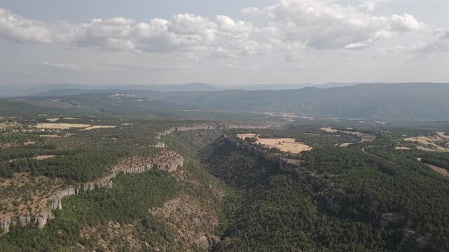 4K 10-bit drone shot flying forward through the deep rocky valley of Tokatli Canyon in Safranbolu, Turkey