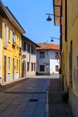 Obraz premium Old buildings along via Cavour, old street in Olgiate Olona, historic town in Varese province, Italy