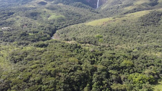Aerial views of Casca D&rsquo;Anta Waterfall in Serra da Canastra National Park, Brazil, featuring towering cliffs, cascading water, rugged landscapes, and the pristine beauty of one of Brazil&rsquo;s most iconic
