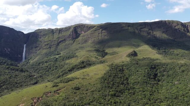Aerial views of Casca D&rsquo;Anta Waterfall in Serra da Canastra National Park, Brazil, featuring towering cliffs, cascading water, rugged landscapes, and the pristine beauty of one of Brazil&rsquo;s most iconic