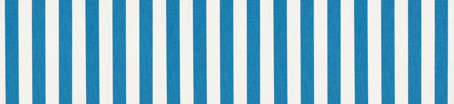 Panoramic view of a striped blue and white fabric pattern featuring distinct textured vertical lines for a maritime theme.