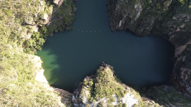 Aerial views of the Capit&oacute;lio Canyons in Minas Gerais, Brazil, showcasing dramatic rock cliffs, emerald waters of Furnas Lake, breathtaking landscapes, and one of the country's most iconic natural att