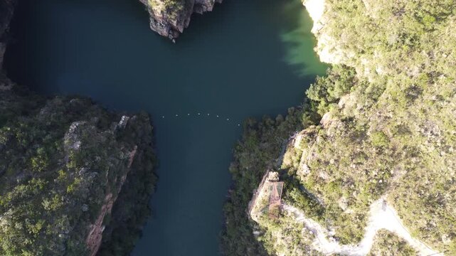 Aerial views of the Capit&oacute;lio Canyons in Minas Gerais, Brazil, showcasing dramatic rock cliffs, emerald waters of Furnas Lake, breathtaking landscapes, and one of the country's most iconic natural att
