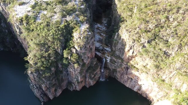 Aerial views of the Capit&oacute;lio Canyons in Minas Gerais, Brazil, showcasing dramatic rock cliffs, emerald waters of Furnas Lake, breathtaking landscapes, and one of the country's most iconic natural att