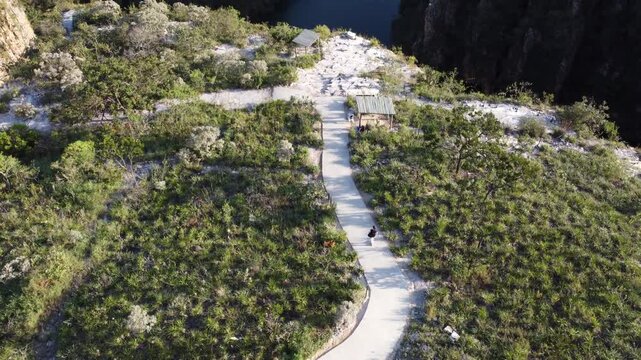 Aerial views of the Capit&oacute;lio Canyons in Minas Gerais, Brazil, showcasing dramatic rock cliffs, emerald waters of Furnas Lake, breathtaking landscapes, and one of the country's most iconic natural att