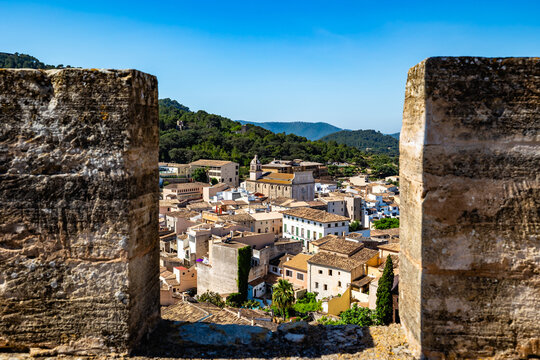 View of Capdepera Town Framed by Castle Walls in Mallorca, Spain