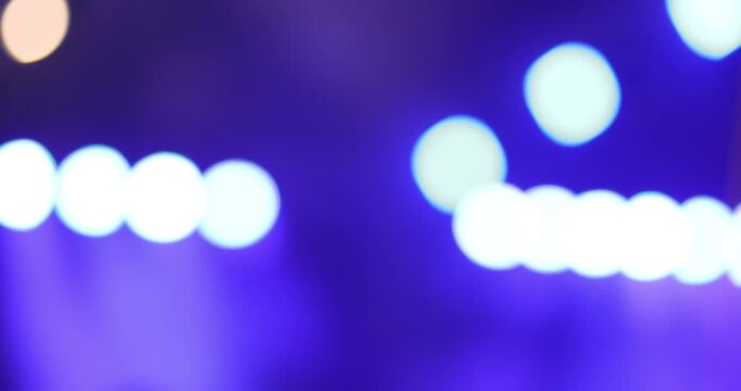 Colorful concert stage lights with dramatic beams and smoke at a live event. Vibrant nightlife, music festival, party, and entertainment atmosphere background