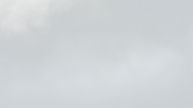 Fog covers a landscape with soft shapes blending together in a gray sky during a cloudy day, PNG with a light overlay