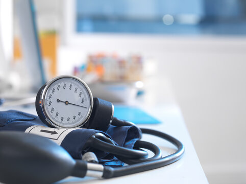 Health Screening, A stethoscope on a patients blood results after a a consultation