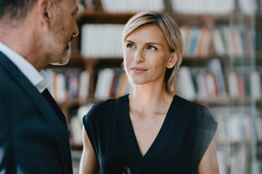 Businessman and woman talking about solutions