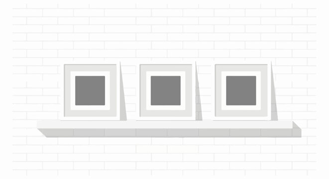 Three empty grey-filled square frames displayed on a shelf against a white brick wall
