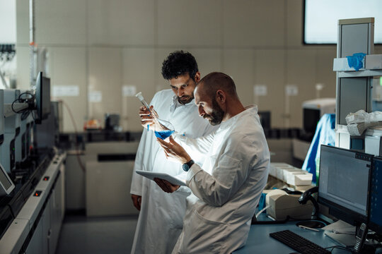 Scientists analyzing a liquid sample in the laboratory