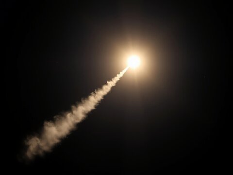 Rocket Launch Illuminates Night Sky with Fiery Ascent
