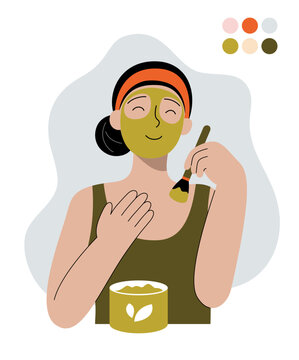 Woman applying green face mask with brush and jar skincare routine
