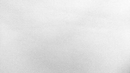 Close-up of white fabric texture with diagonal pattern background.