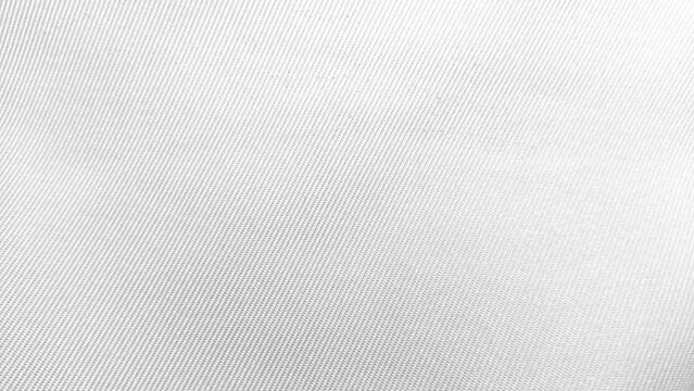 Close-up of white fabric texture with diagonal pattern background.
