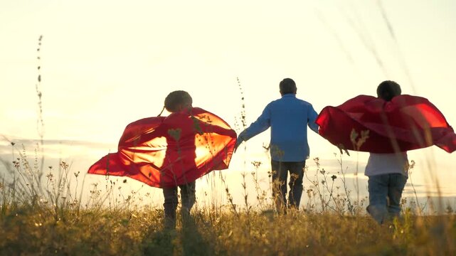 young boy father become superheroes nature playground chasing dreams experiencing power teamwork. power childhood dreams young boys girls play become superheroes nature playground. adventure now. joy