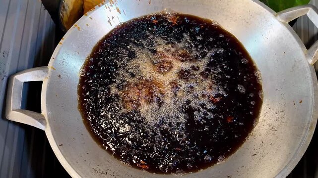 Deep Frying Marinated Chicken in Hot Oil at Thai Street Food Stall