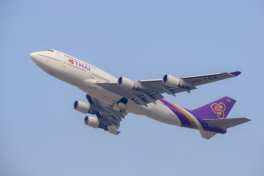 Chek Lap Kok, Hong Kong Japan - 2018 January 23: A Thai Airways International Boeing 747-400 passenger aircraft with registration HS-TGA climbing into the sky after takeoff from Hong Kong Internationa
