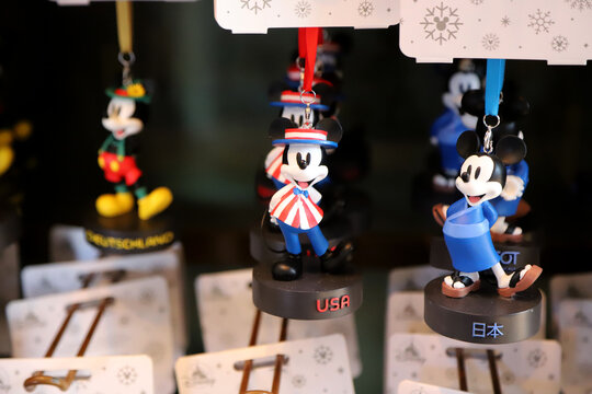 
Sale of souvenir decorations with a Mickey Mouse theme representing different countries
