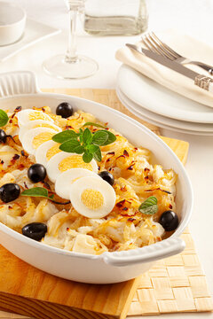 Cod with onions and boiled egg, Portuguese style.