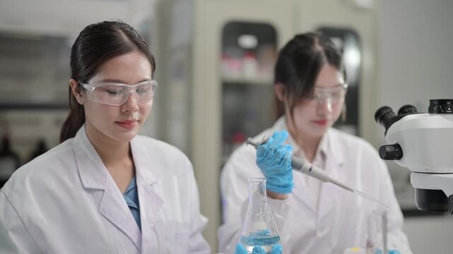 Chemistry students conduct experiments in laboratory setting during afternoon hours