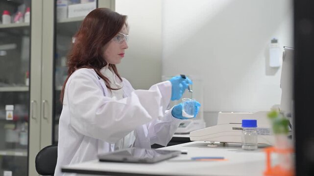 Scientist conducts experiments in laboratory on a weekday afternoon