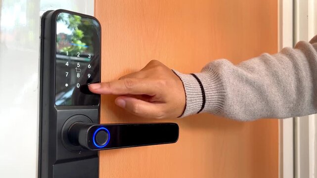 Woman finger entering PIN code on smart door lock keypad getting error in modern apartment