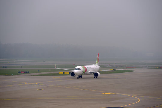 TAP Air Portugal passenger airplane type Airbus A321LR registration CS-TXI Zeca Afonso taxiing at Swiss Z&uuml;rich Airport on an autumn day. Photo taken November 7th, 2025, Zurich Airport, Switzerland.