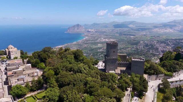 Aerial view of the medieval village of Erice and the Balio Towers, with the Mediterranean Sea and Mount Cofano in the background, Sicily, Italy