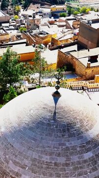Vertical video of Abdullatif (Latifiye) Mosque dome in Mardin, Turkey. Showcasing Islamic architecture, stone craftsmanship, cultural heritage, and the city's historic atmosphere.
