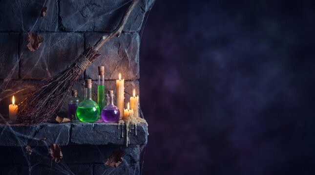 Spooky halloween setup with broom candles and potion bottles on stone shelf