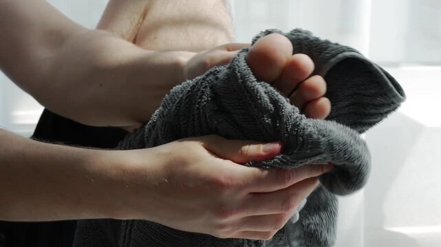 Clean feet after a shower.
Foot care.
The concept of cleanliness and foot care.