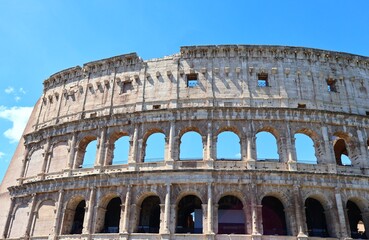 Fototapeta premium Colosseum Historic Landmark Under Blue Sky in Rome Italy
