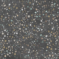 Fototapeta premium A close-up view of a textured, dark grey surface embedded with numerous small, irregular chips of various colors, creating a mosaic-like pattern