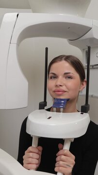 Woman undergoing panoramic dental x-ray examination