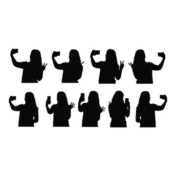 Silhouettes of women taking selfies vactor file