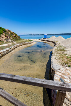 Wooden fence that is next to a body of water, Ammoulliani, Greece