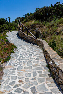 Stone path that is going up a hill, Ammoulliani, Greece
