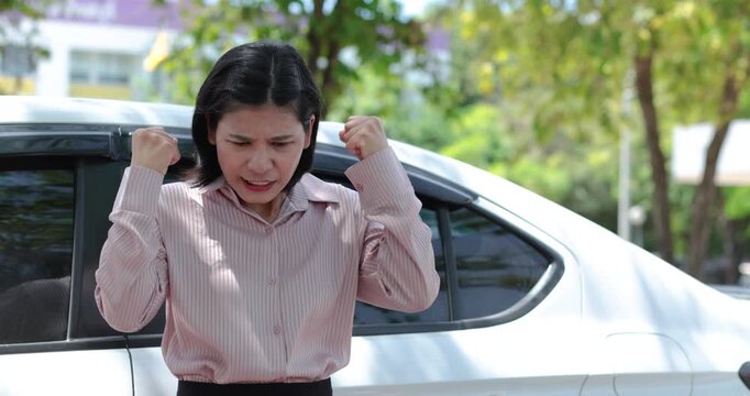 Stressed woman beside a car outdoors, Businesswoman missed career goals, representing frustration, unemployment, anger, pressure, waiting and failure, Thai Asian woman