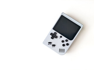 Retro handheld gaming console on a white background. © asep