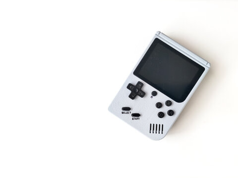 Retro handheld gaming console on a white background.